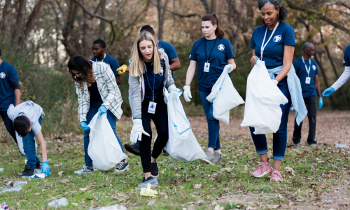 People cleaning plastic waste and reducing environmental impact