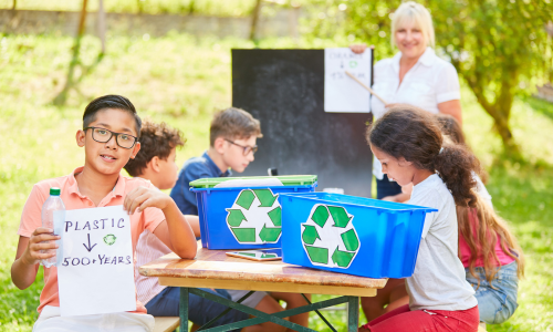 Kids picking up trash and learning about recycling