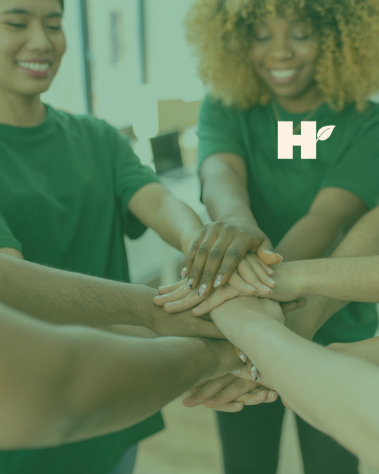 Close up of Volunteers Stacking Hands